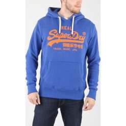 SuperDry Bluza Niebieski. Niebieskie bluzy męskie Superdry, xl, z nadrukiem, z bawełny, bez kołnierzyka, bez rękawów, bez kaptura. Za 395,95 zł.