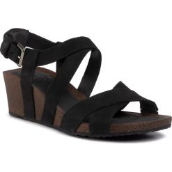 Sandały TEVA - Mahonia Wedge Cross Strap 1106860 Blk. Czarne klapki damskie Teva, bez wzorów, ze skóry, bez obcasa, na obcasie. W wyprzedaży za 339,00 zł.