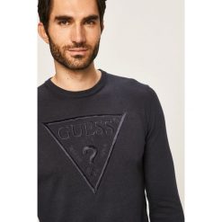 Guess Jeans - Sweter. Niebieskie swetry męskie Guess Jeans, s, z aplikacjami, z bawełny, z okrągłym kołnierzem, bez kaptura. W wyprzedaży za 299,90 zł.