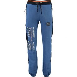 Spodnie dresowe "Mindwiller" w kolorze niebieskim. Niebieskie joggery męskie marki Geographical Norway, z aplikacjami, z dresówki. W wyprzedaży za 117,95 zł.