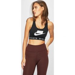 Nike - Biustonosz sportowy. Czarne biustonosze sportowe damskie marki Nike, s, z nadrukiem, z elastanu. Za 139,90 zł.