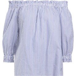 Emporio Armani Bluzka white. Białe tuniki damskie Emporio Armani, bez wzorów, z bawełny, bez kołnierzyka, bez rękawów. W wyprzedaży za 350,55 zł.