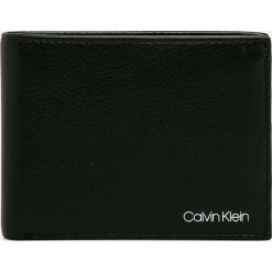 Calvin Klein - Portfel. Czarne portfele męskie Calvin Klein, bez wzorów, ze skóry ekologicznej. Za 299,90 zł.