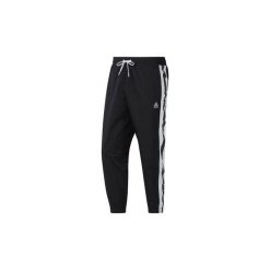 Spodnie treningowe Reebok Sport Spodnie Meet You There 7/8. Czarne spodnie męskie Reebok Sport, s, bez wzorów, sportowe. Za 199,00 zł.