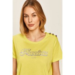 Liu Jo - T-shirt. Żółte bluzki damskie Liu Jo, s, z nadrukiem, z bawełny, casualowe, z okrągłym kołnierzem. W wyprzedaży za 129,90 zł.