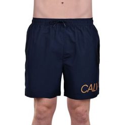 Calvin Klein Męskie szorty Medium Drawstring KM0KM00303 -445 BlueShadow (rozmiar M). Pomarańczowe kąpielówki męskie Calvin Klein, m, bez wzorów. W wyprzedaży za 198,00 zł.