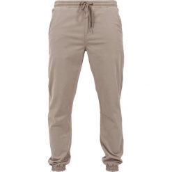 Spodnie dresowe męskie: Urban Classics Spodnie treningowe beige
