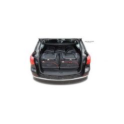 OPEL ASTRA TOURER, 2009-2015 TORBY DO BAGAŻNIKA 5 SZT KJUST - 7031008. Torby podróżne KJUST, bez wzorów, z kauczuku, klasyczne. Za 1319,00 zł.