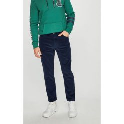 Tommy Jeans - Spodnie. Niebieskie spodnie męskie Tommy Jeans, na co dzień, bez wzorów, z bawełny, casualowe. W wyprzedaży za 239,90 zł.