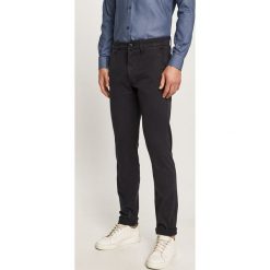 Guess Jeans - Spodnie. Niebieskie spodnie męskie Guess Jeans, na co dzień, m, z aplikacjami, z elastanu. Za 369,90 zł.
