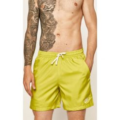 Nike Sportswear - Szorty. Żółte spodenki sportowe męskie Nike Sportswear, s, bez wzorów, z poliesteru, sportowe. W wyprzedaży za 99,90 zł.