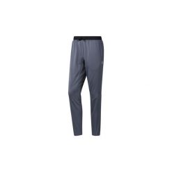 Spodnie treningowe Reebok Sport Spodnie WOR Trackster. Szare spodnie męskie marki Reebok Sport, s, bez wzorów, sportowe. Za 149,00 zł.