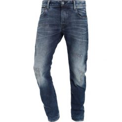 GStar ARC 3D SLIM Jeansy Slim Fit medium aged restored 86. Niebieskie jeansy męskie relaxed fit marki G-Star. W wyprzedaży za 524,25 zł.