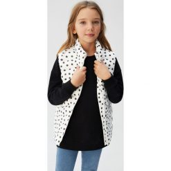 Mango Kids - Bezrękawnik dziecięcy Ali 110-164 cm. Białe kurtki dziewczęce Mango Kids, bez wzorów, z poliesteru, bez kaptura. W wyprzedaży za 63,90 zł.