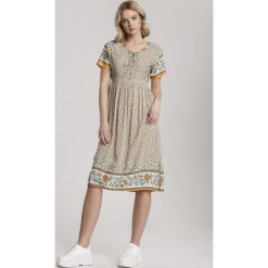 Jasnobeżowa Sukienka Cordelena. Brązowe sukienki damskie Renee, na lato, s, w paski, bez kołnierzyka, z krótkim rękawem, krótkie, midi, rozkloszowane. Za 59,99 zł.