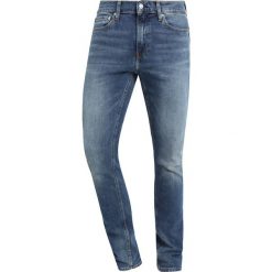 Calvin Klein Jeans 026 SLIM Jeansy Slim Fit blue denim. Niebieskie jeansy męskie marki Calvin Klein Jeans, z elastanu. Za 419,00 zł.