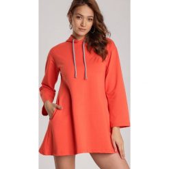 Pomarańczowa Bluza Aigagonia. Pomarańczowe tuniki damskie Renee, xl, bez wzorów, bez kołnierzyka, bez rękawów. Za 89,99 zł.