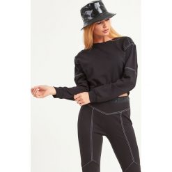 BLUZA LIU JO SPORT. Czarne bluzy sportowe damskie Liu Jo Sport, xs, bez wzorów, z tkaniny, bez rękawów, bez kaptura. Za 459,00 zł.