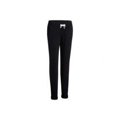 Spodnie slim Gym & Pilates 500 damskie. Czarne rurki damskie DOMYOS, xs, bez wzorów, z elastanu. Za 59,99 zł.