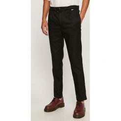 Calvin Klein - Spodnie. Czarne spodnie męskie Calvin Klein, s, bez wzorów, z elastanu. Za 579,90 zł.