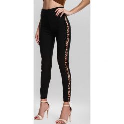 Czarne Legginsy Demonstrable. Czarne legginsy damskie marki other, s, z aplikacjami. Za 39,99 zł.