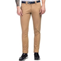 Spodnie STEFANO SMKS030022. Brązowe spodnie męskie Giacomo Conti, m, bez wzorów, z elastanu. Za 199,00 zł.