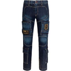Spodnie AERONAUTICA MILITARE. Niebieskie spodnie męskie Aeronautica Militare, z aplikacjami, z jeansu, militarne. Za 1070,00 zł.
