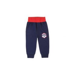 Spodnie niemowlęce chłopięce sportowe. Niebieskie spodnie niemowlęce TXM, bez wzorów, sportowe. Za 19,99 zł.