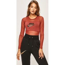 Nike Sportswear - Body. Brązowe topy damskie Nike Sportswear, s, z nadrukiem, z elastanu, z długim rękawem. W wyprzedaży za 159,90 zł.