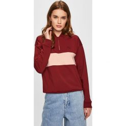 Lacoste - Bluza. Brązowe bluzy damskie Lacoste, z nadrukiem, z elastanu, z krótkim rękawem, krótkie, bez kaptura. W wyprzedaży za 269,90 zł.