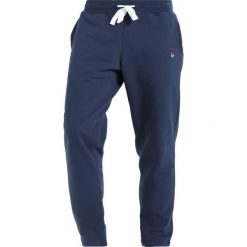 Spodnie dresowe męskie: Orsman GUIDE TRACK PANTS Spodnie treningowe navy