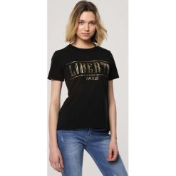 Czarny T-shirt Sustainability. Czarne bluzki damskie Born2be, s, z nadrukiem, z okrągłym kołnierzem. Za 49,99 zł.