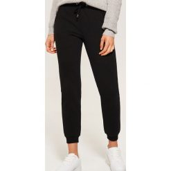 Dresowe joggery - Czarny. Czarne spodnie męskie House, s, bez wzorów, z dresówki. Za 79,99 zł.