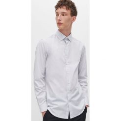 Koszula slim fit z drobnym wzorem - Biały. Białe koszule męskie Reserved, s, bez wzorów, bez kołnierzyka, bez rękawów. Za 89,99 zł.