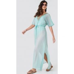 NA-KD Boho Zdobiona sukienka typu kaftan - Green. Zielone sukienki damskie NA-KD Boho, z aplikacjami, z poliesteru, boho, bez kołnierzyka, z krótkim rękawem, krótkie, mini. W wyprzedaży za 64,78 zł.