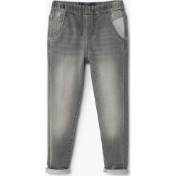 Mango Kids - Jeansy dziecięce Comfy 104-164 cm. Szare jeansy męskie marki Mango Kids, z elastanu. W wyprzedaży za 69,90 zł.