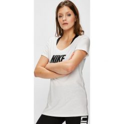 Nike Sportswear - Top sportowy. Szare topy sportowe damskie marki Nike Sportswear, s, z nadrukiem, z bawełny, z okrągłym kołnierzem. W wyprzedaży za 84,90 zł.