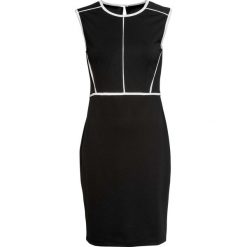 Sukienka z dżerseju z kontrastowymi szwami bonprix czarno-biały. Czarne sukienki damskie bonprix, z dżerseju, eleganckie. Za 64,99 zł.