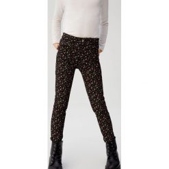 Mango Kids - Spodnie dziecięce Flo 110-164 cm. Szare spodnie dziewczęce Mango Kids, bez wzorów, z elastanu. W wyprzedaży za 59,90 zł.