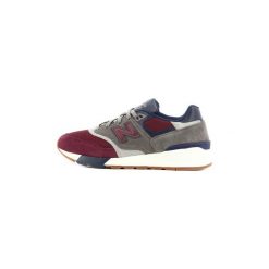 Buty New Balance ML 597. Niebieskie trampki męskie New Balance, bez wzorów, bez zapięcia. Za 377,76 zł.