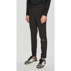 Reebok - Spodnie. Czarne spodnie męskie Reebok, m, z elastanu, sportowe. W wyprzedaży za 149,90 zł.