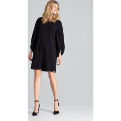 Sukienka trapezowa z szerokimi rękawami czarna - l/xl. Czarne sukienki damskie e-margeritka.pl, na co dzień, s, bez wzorów, z elastanu, eleganckie, bez kołnierzyka, z długim rękawem, długie, midi, proste. Za 174,99 zł.
