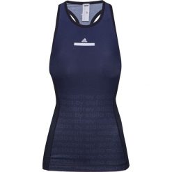 Top ADIDAS BY STELLA McCARTNEY TRAIN MIRACLE. Niebieskie topy damskie adidas by Stella McCartney, bez wzorów, z kontrastowym kołnierzykiem. W wyprzedaży za 246,00 zł.