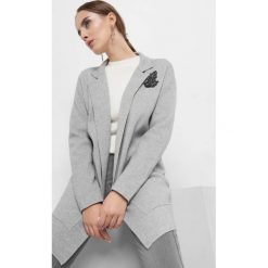 Kardigan z koralikami. Czarne kardigany damskie Orsay, s, z aplikacjami, z dzianiny. Za 139,99 zł.