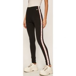 Tommy Jeans - Legginsy. Czarne spodnie damskie Tommy Jeans, s, bez wzorów, z elastanu, casualowe. Za 359,90 zł.