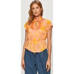 Vero Moda - Bluzka. Pomarańczowe bluzki damskie Vero Moda, na co dzień, s, bez wzorów, z wiskozy, casualowe, bez kołnierzyka, z krótkim rękawem. Za 219,90 zł.