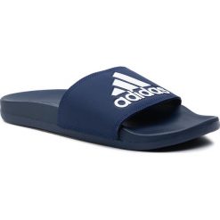 Klapki adidas - adilette Comfort B44870 Dkblue/Ftwwht/Dkblue. Niebieskie klapki damskie Adidas, bez wzorów, z tworzywa sztucznego, bez obcasa. W wyprzedaży za 119,00 zł.