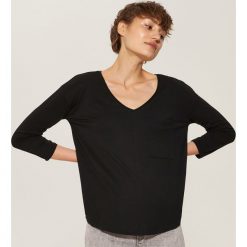 Bluzka z kieszenią - Czarny. Czarne bluzki damskie House, s, bez wzorów, bez kołnierzyka, bez rękawów. Za 39,99 zł.