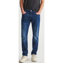 Dopasowane jeansy - Granatowy. Niebieskie jeansy męskie marki Reserved, m, bez wzorów. Za 99,99 zł.
