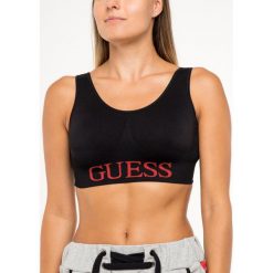 Biustonosz top Guess Logo Front Sports O92A04 JR045. Czarne biustonosze Guess, z aplikacjami, z elastanu. W wyprzedaży za 99,00 zł.